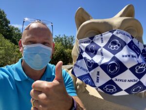 Mr. Fred wearing safety mask with the Nittany Lion